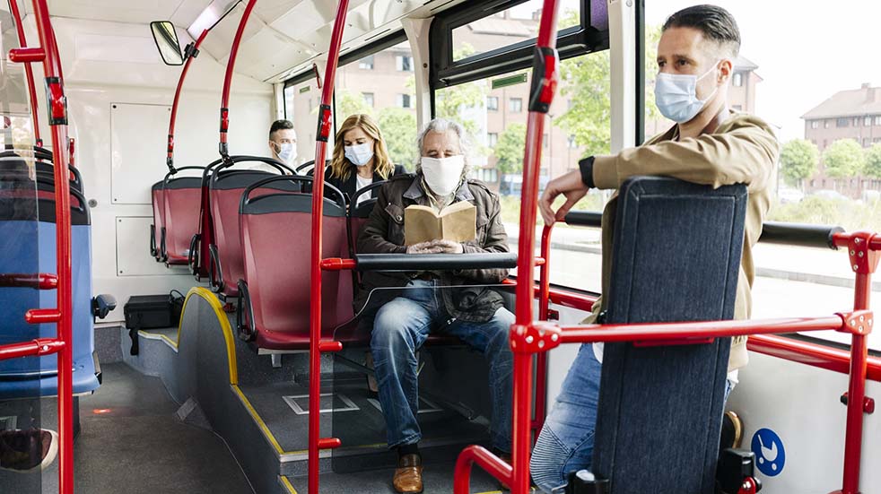 Public transport guidelines people on bus face masks
